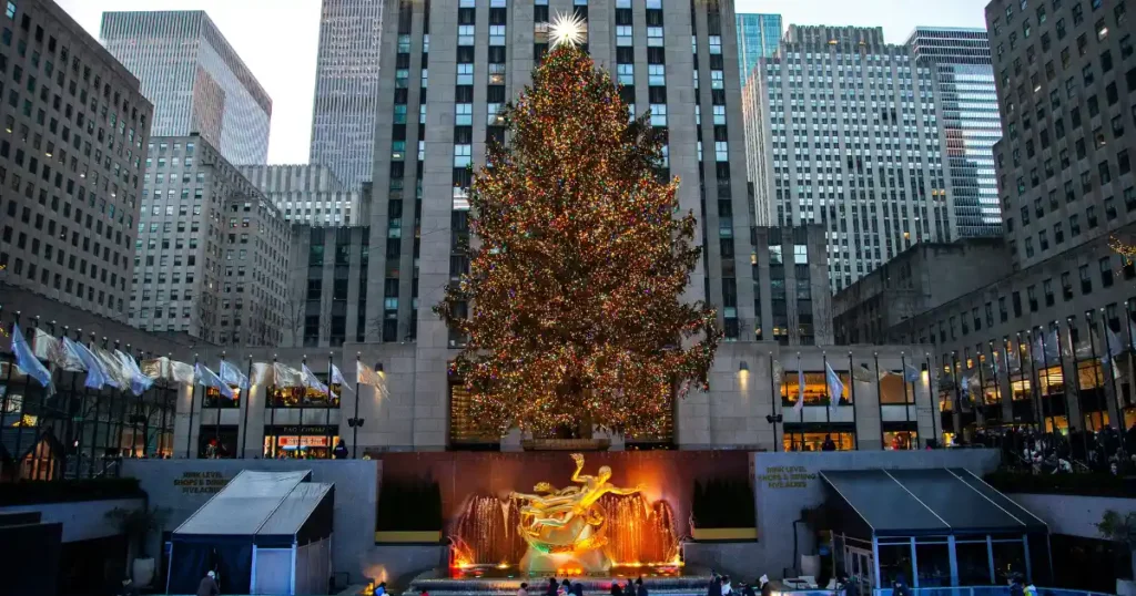 The iconic Rockefeller Center Christmas Tree illuminated at night, cementing New York City as one of the best places to go in december for holiday magic and festive city energy.