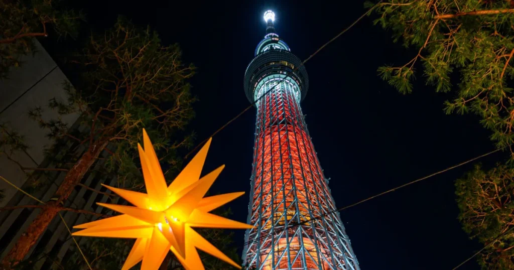 Tokyo Skytree illuminated brightly at night; Japan is definitively one of the best countries to visit in december for festive cityscapes.
