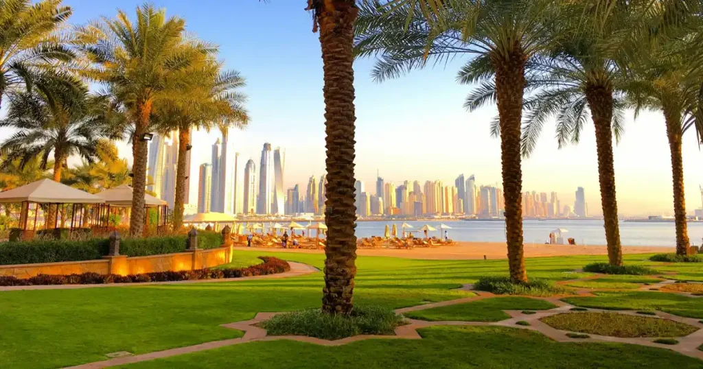 Sunny beach with Dubai skyline, perfect for places to go in december hot.