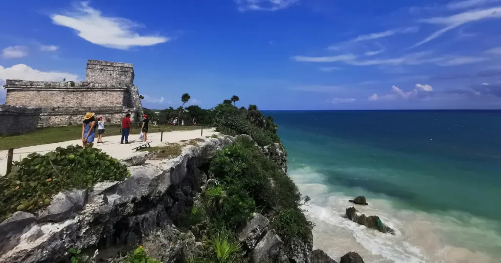 Sunny beach near Tulum ruins, among the best warm places to visit in December.