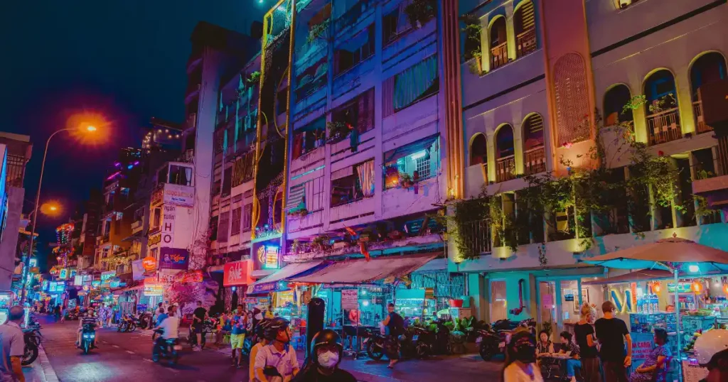 Vibrant night street food scene in Vietnam, highlighting the best places to visit in december