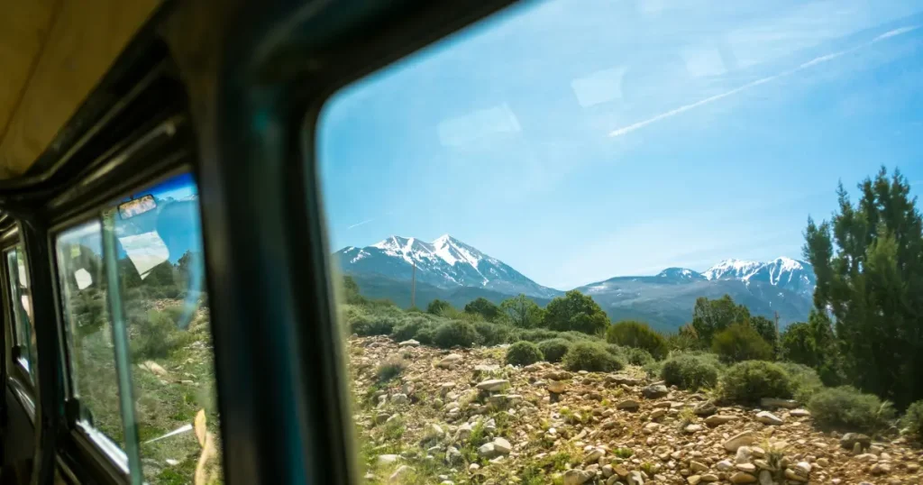 Enjoying the scenic mountain views from a local bus while travelling through the balkans.